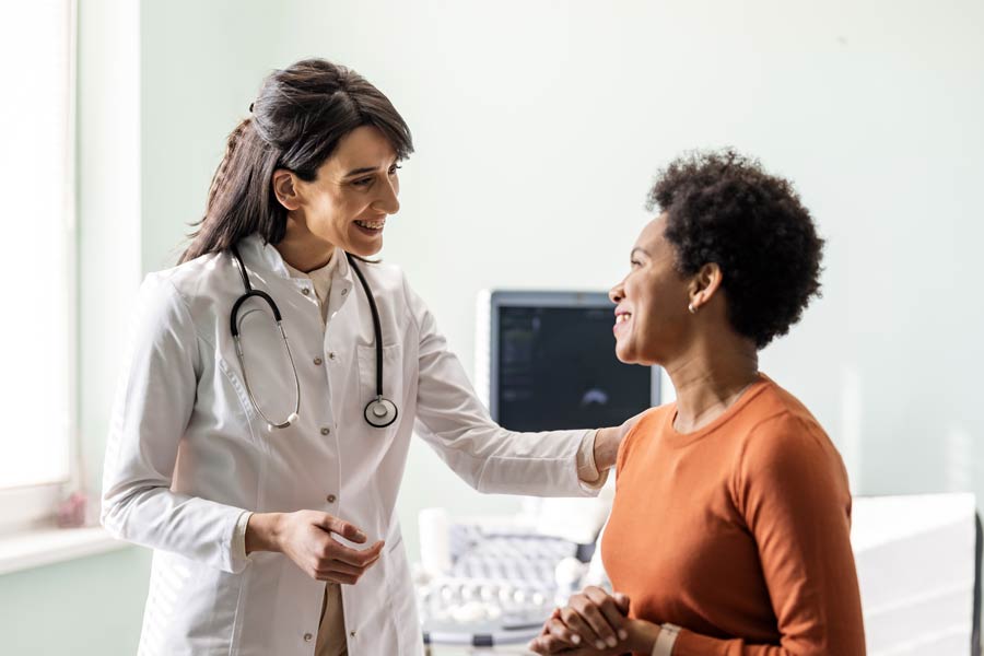 Photo of a woman talking to her doctor